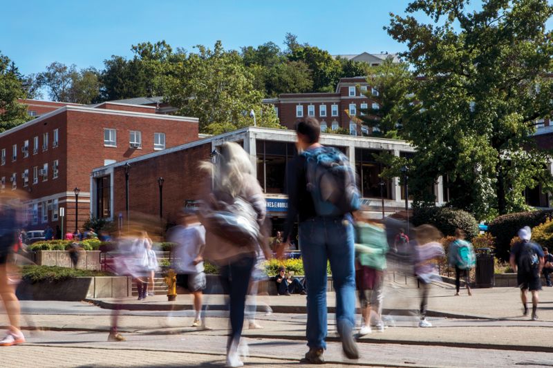 Blurred student movement at crossing in front of Mountainlair.
