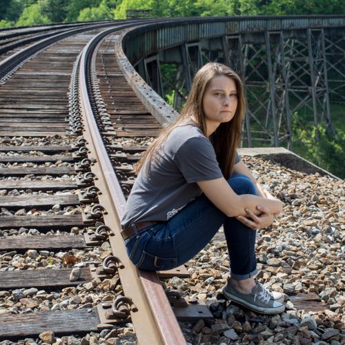 Savannah Lusk on train trestle