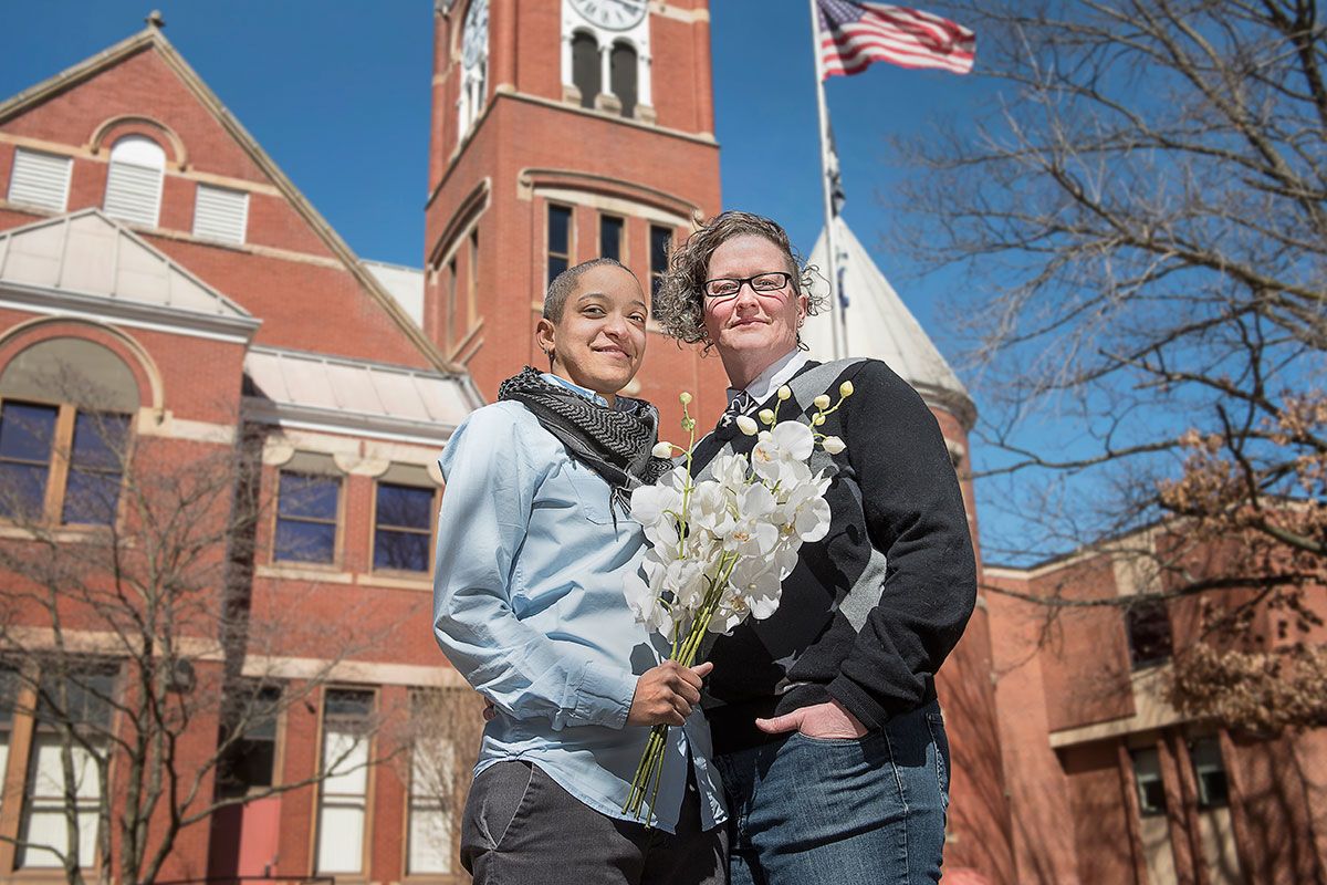 Rayna Momen and Emily Smith-Zimmerman pose outside the courthouse where they married.