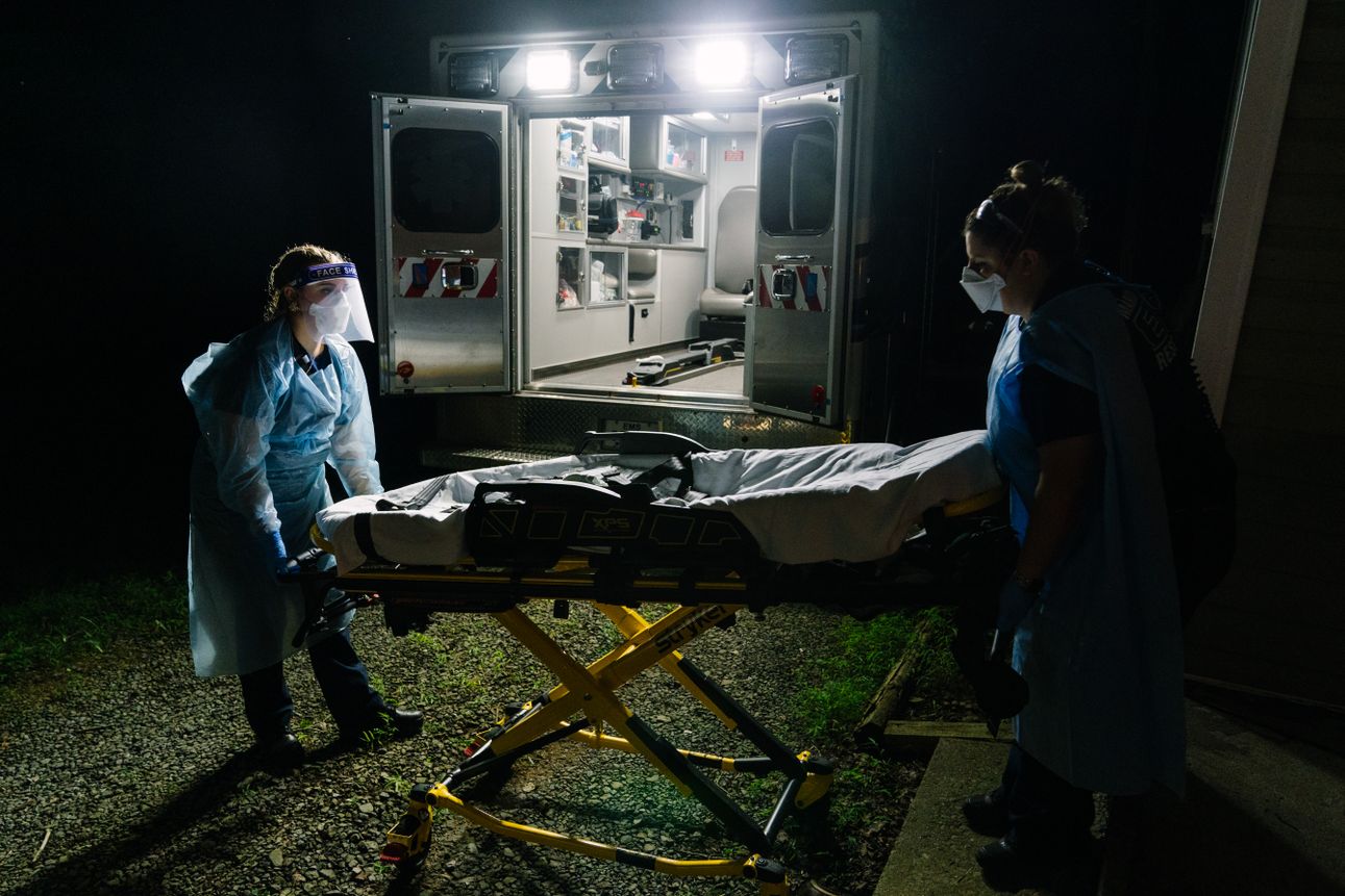 Marion County EMS medics prepare to load the body of a man believed to have been infected with COVID-19 into their ambulance on August 6th, 2020. Photo: Chris Jones