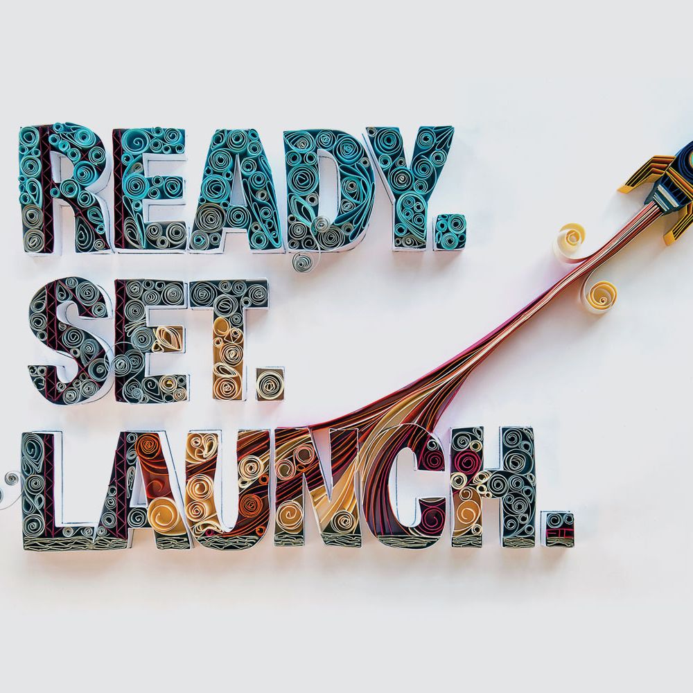 A paper quilling graphic that says "Ready. Set. Launch." and has a rocket flying away.