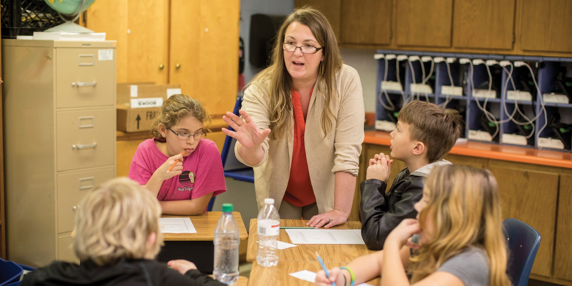 Joanna Burt-Kinderman teaches math in a classroom.