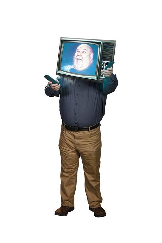 Man smiling with TV on his head 