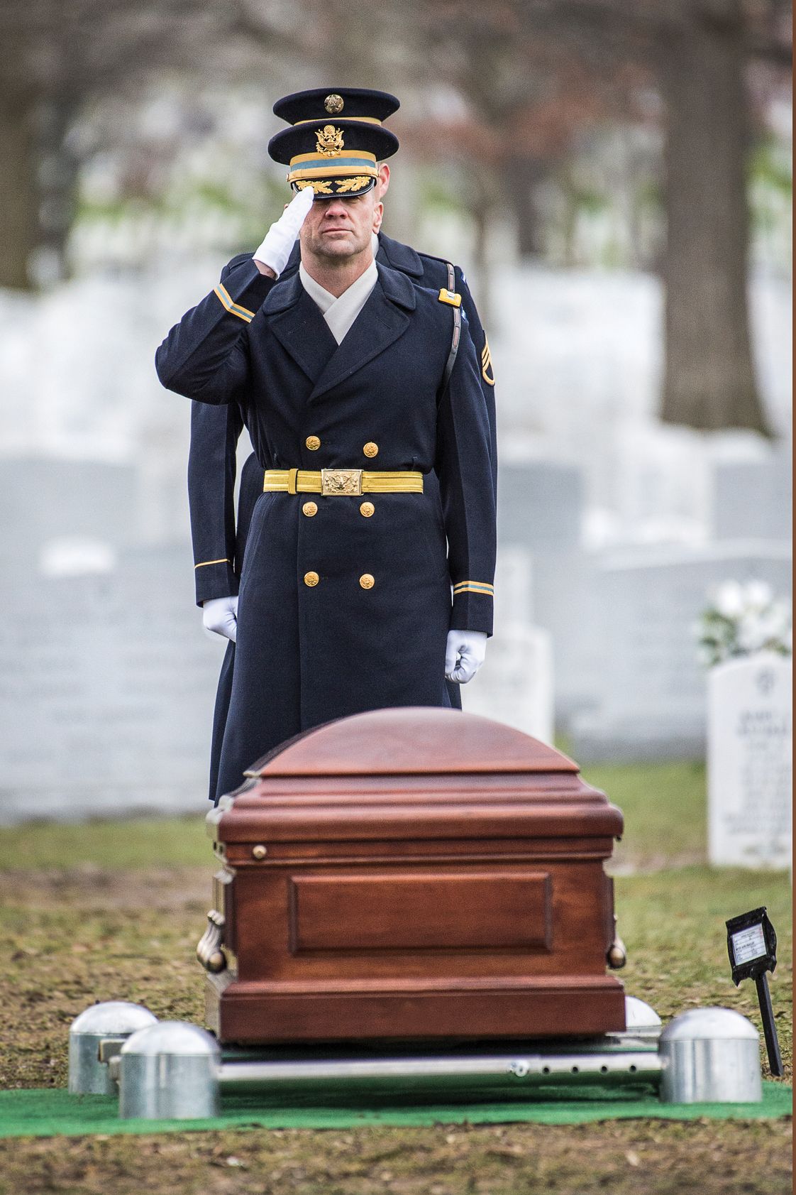 Lt. Col. Dave Taylor salutes the casket