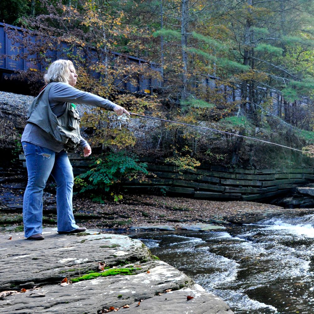 A woman fly fishes on a creek that now has public access.