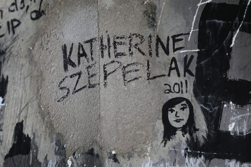 Katherine Szepelak signed her name and drew a self-portrait in 2011.