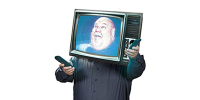 Man smiling with tv on his head 