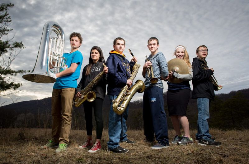 High School band members on a hill.
