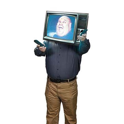 Man smiling with TV on his head 