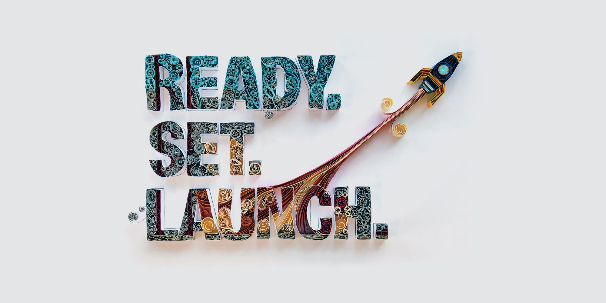 Paper quilling graphic that says "Ready. Set. Launch." and has a rocket flying away.