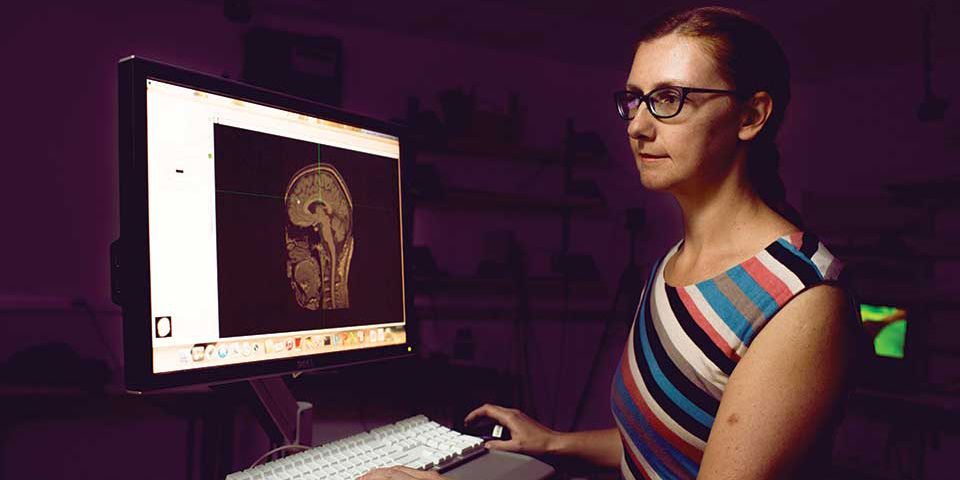 Valeriya Gritsenko looks at an image of a brain.