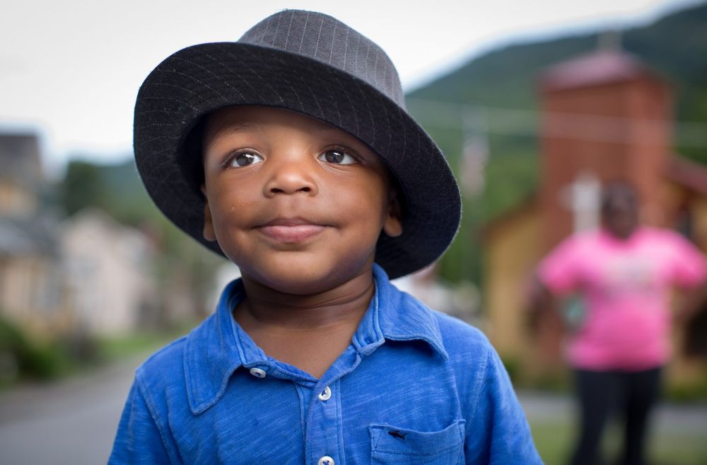 Child wearing a hat.