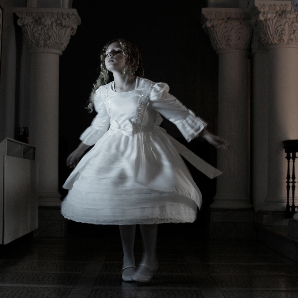 Ghostly girl spins in her party dress at Stewart Hall.