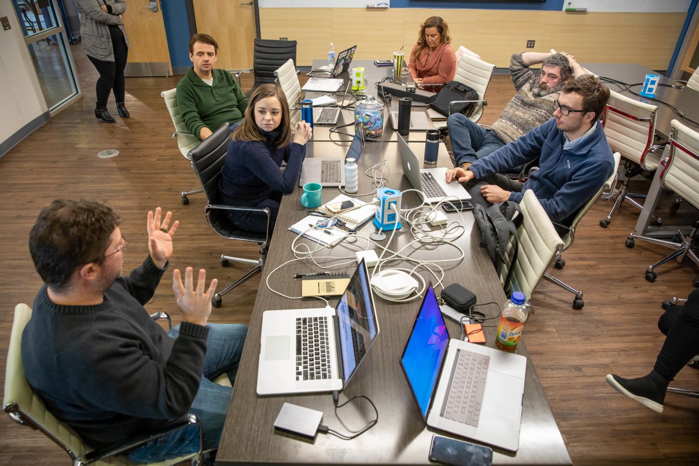 The 100 Days in Appalachia editorial team meets at the WVU Media Innovation Center.