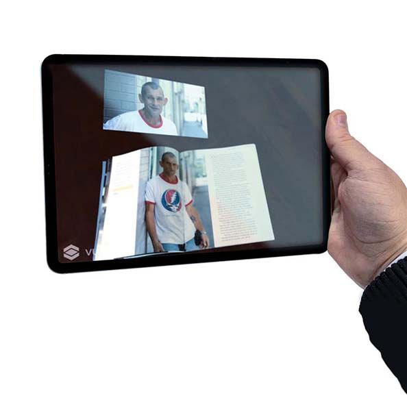 Tablet being held with a man smiling 