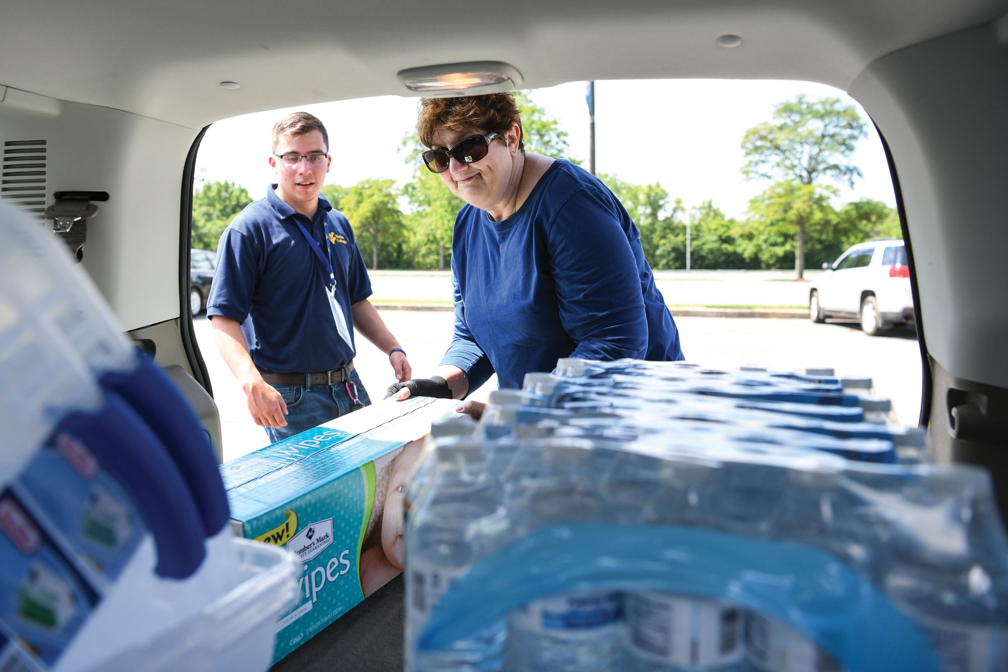 Volunteers collect donations for flood relief.