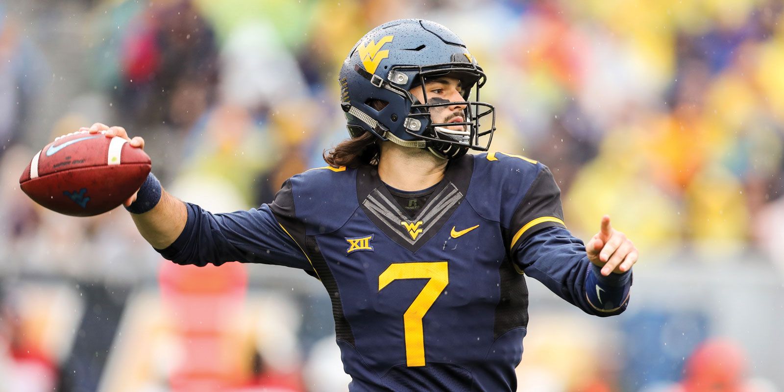 Will Grier throwing a football