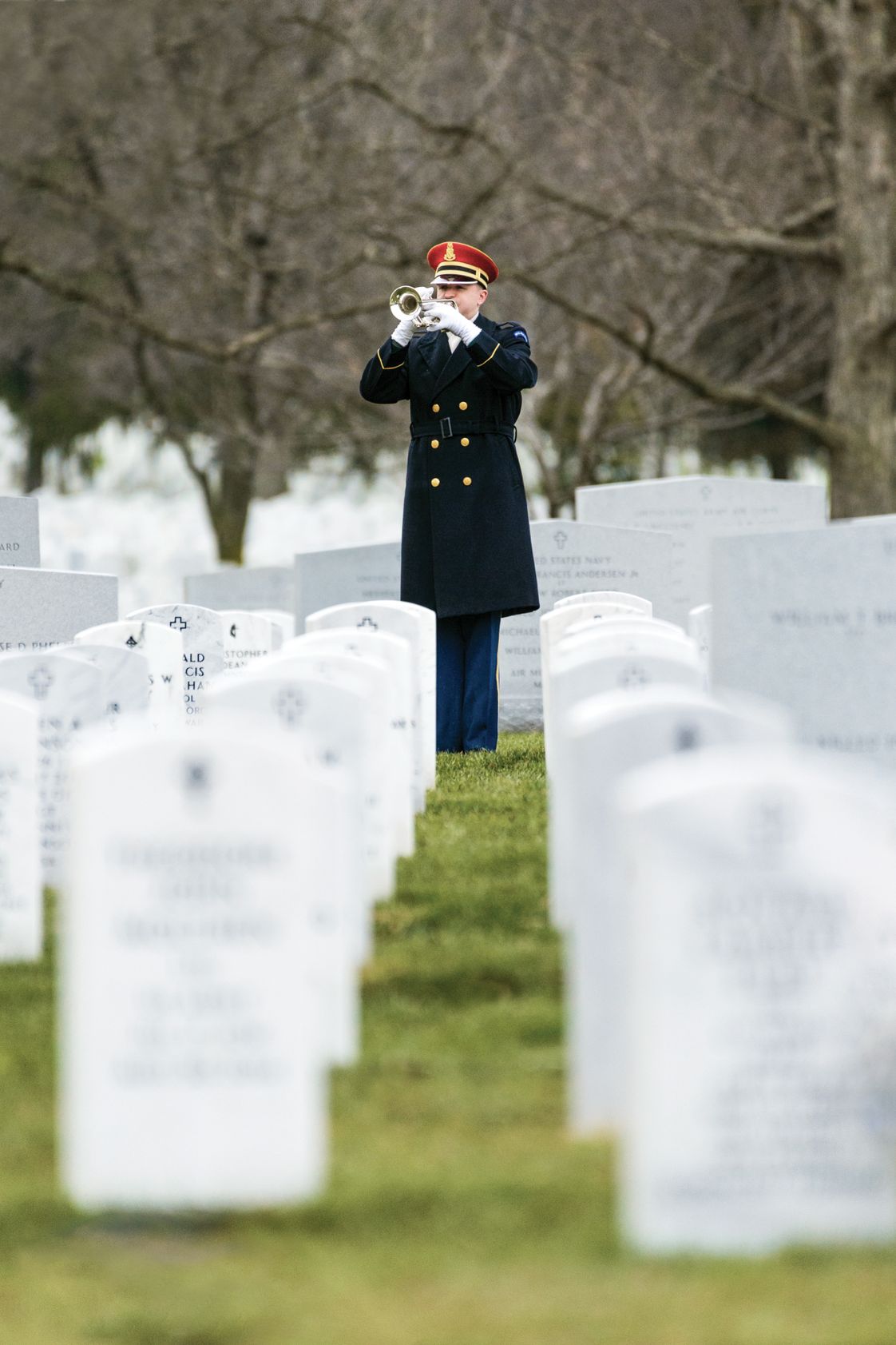  A trumpet player in the U.S. Army Band plays Taps