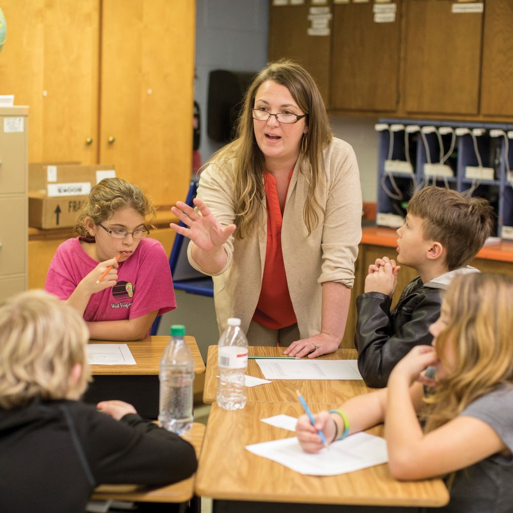 Joanna Burt-Kinderman teaches math in a classroom. 